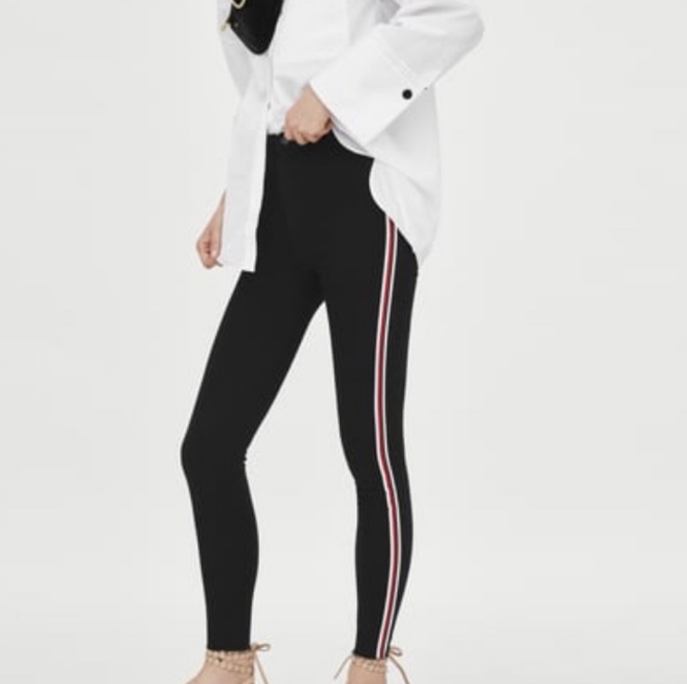 Black jeans with stripe.